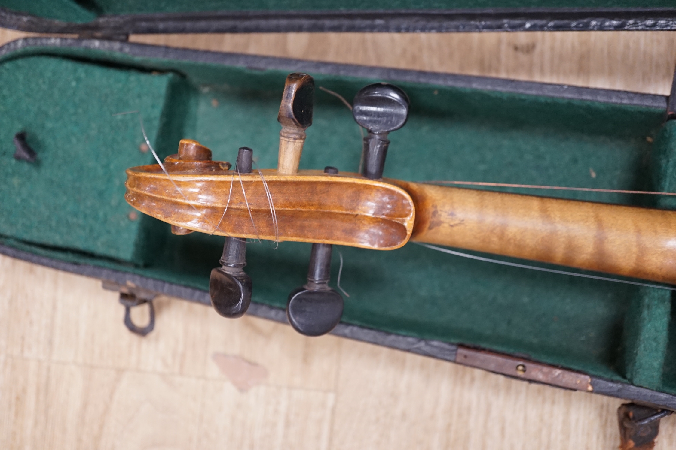 A cased early 20th century violin, length of body, 35.5cm, without bow